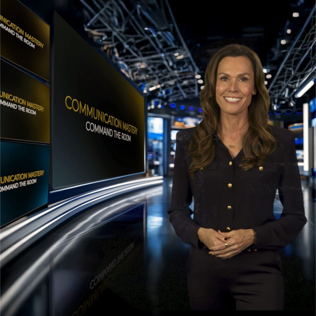 A woman presenting in a modern studio with digital displays.